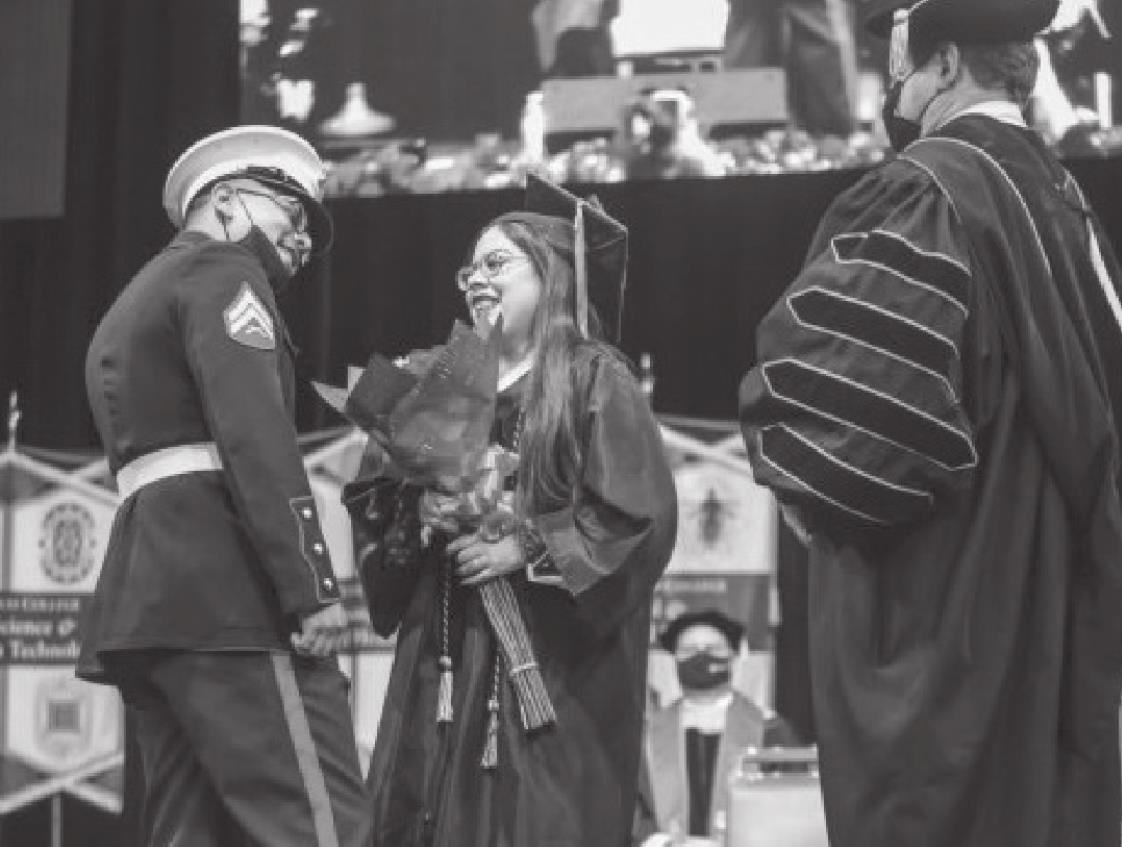 Marine Cpl. Christopher Castillo surprised his wife Janeth with a surprise visit at STC Commencement during the 3 p.m. ceremony Dec. 12. Photo Courtesy STC