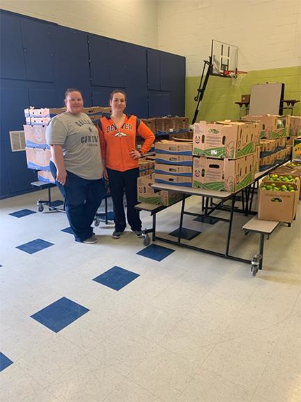Vanguard Academy parent Michelle Cortez (right) donated hundreds of organic vegetables to Vanguard Academy families. Cortez’s children attend Vanguard Academy Rembrandt Elementary and Secondary. Cortez’s family owns a produce company in Hidalgo.