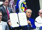 Gov. Greg Abbott signs an emergency declaration related to the New World screwworm at a news conference at the Texas Emergency Operations Center on Friday. LEILA SAIDANE/ ProPublica via The Texas Tribune