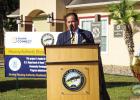 Above: Pharr Housing Authority Board Chairman Mario Lizcano speaks in this recent photo in Pharr. Below: Representatives from the Pharr Housing Authority and City of Pharr are seen in this recent photo. City of Pharr Photo