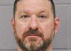 Head coach charged with assault