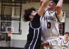 PHOTOS BY P.J. HERNANDEZ/ Advance News Journal Above: Mason Lopez goes up for a basket against the Robert Vela SaberCats during a district game on Jan. 23 in Pharr. Below: Lopez shakes his father’s hand during the college signing that took place at PSJA