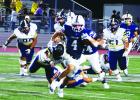 PHOTOS BY P.J. HERNANDEZ/ Advance News Journal Above: PSJA Southwest’s Raul Garza scrambles from Hidalgo defenders on Thursday at PSJA Stadium. Below: PSJA Southwest’s Edward Montanez and Christopher Merkich look to stop a pass against Hidalgo.
