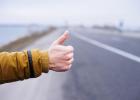 Standing on the turnpike, thumb out to hitchhike
