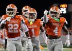 UTRGV defensive backs, Carter Hewitt, Alijah Prosser and Marcus Heard Jr., celebrate after getting an interception against McNeese State on Saturday at Robert & Janet Vackar Stadium in Edinburg. | P.J. Hernandez/ANJ Article Image Alt Text
