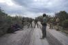 Texas Department of Public Safety special agents monitor four undocumented immigrants from Honduras who were caught on private property in Kinney County on Nov. 9, 2021. GABRIEL CÁRDENAS/ ProPublica via The Texas Tribune
