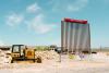 A mock border wall stands in front of Venga Coffee in Terlingua on Aug. 12. SARAH M. VASQUEZ/ The Texas Tribune