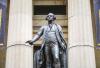 A statue of George Washington is seen in front of the Federal Hall National Memorial in New York. Zack Frank/ Adobe Stock